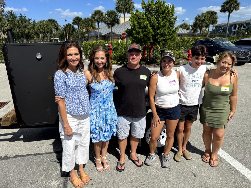 Staff and Volunteers posing together outside near grill during Valerie’s House Volunteer Appreciation Day
