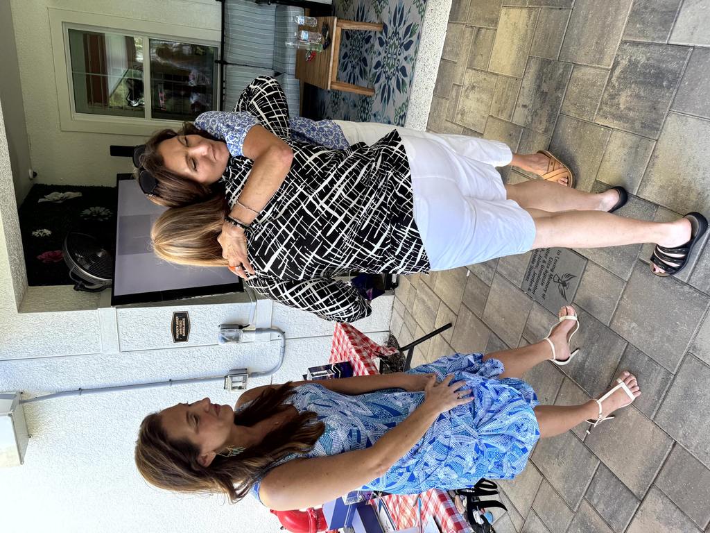 Staff and volunteer sharing a hug during appreciation event at Valerie’s House Fort Myers