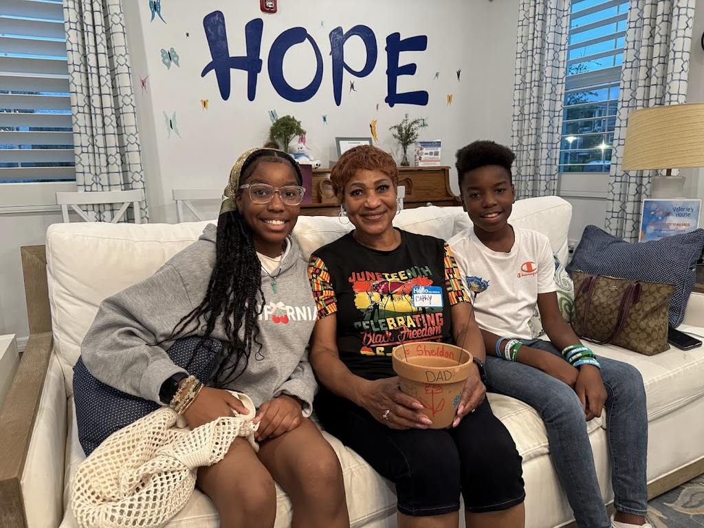 Family participating in a grief activity at the Valerie’s House Family is Forever Home in Fort Myers