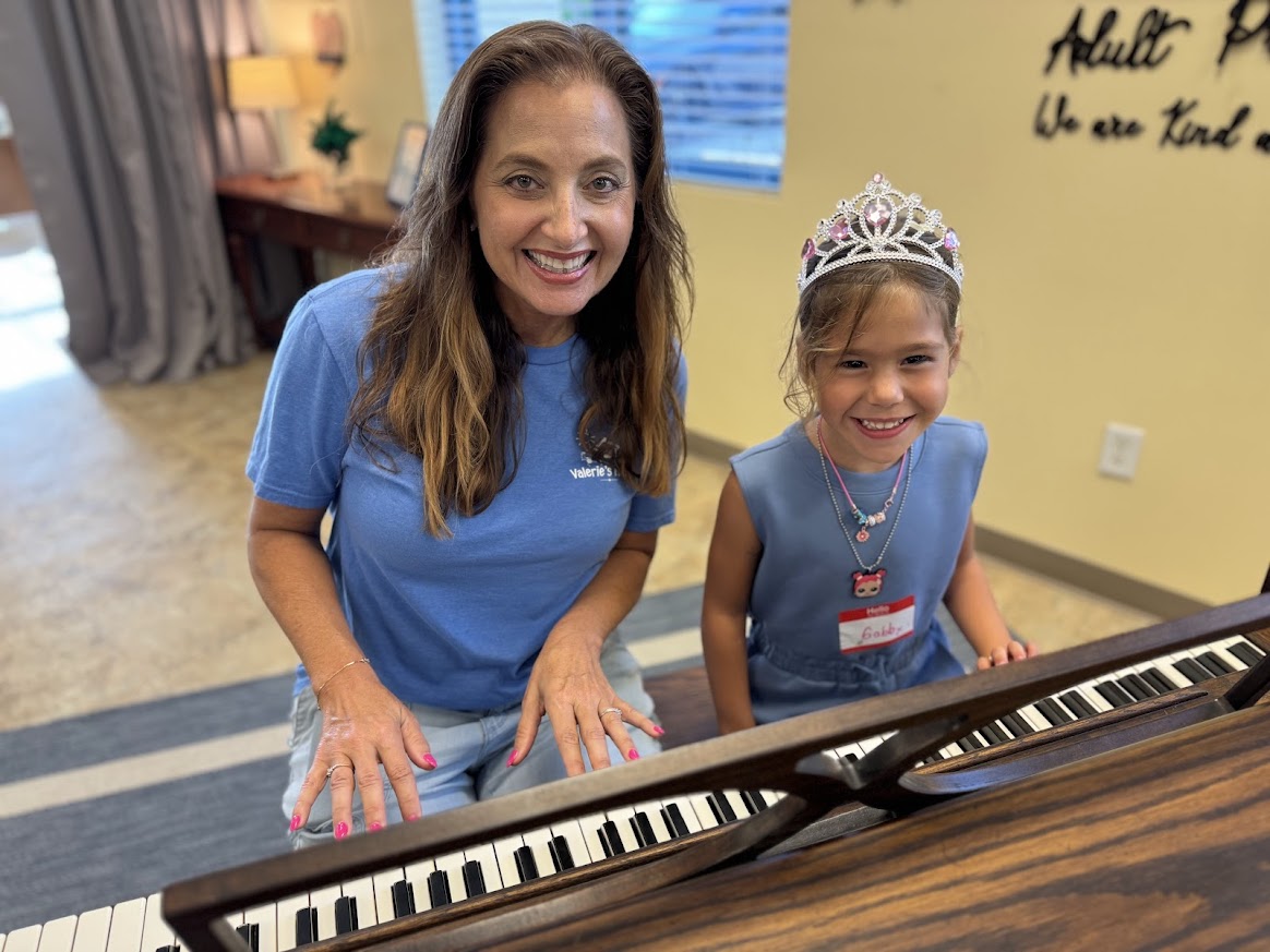 Angela Melvin plays piano with Gabby during a Valerie’s House group night in Naples.
