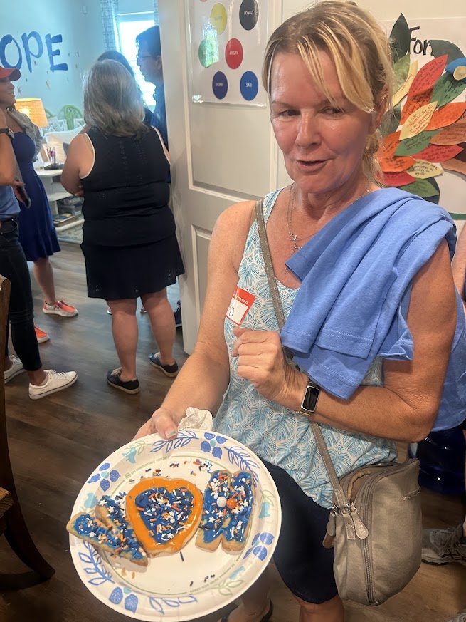 SWFL Gator Club volunteers and Valerie’s House families celebrate International Gator Day at the Fort Myers Family is Forever Home.