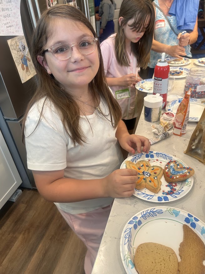 SWFL Gator Club volunteers and Valerie’s House families celebrate International Gator Day at the Fort Myers Family is Forever Home.