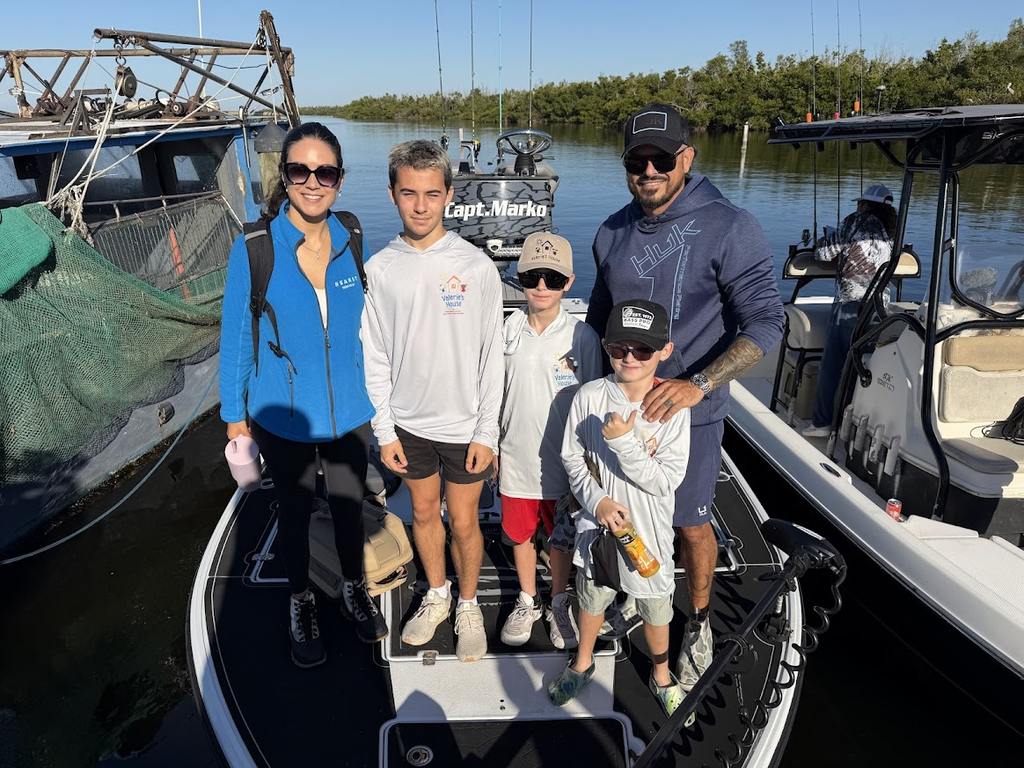 Valerie’s House children and teens with Captain James Marko on a fishing boat before their ESPN feature.