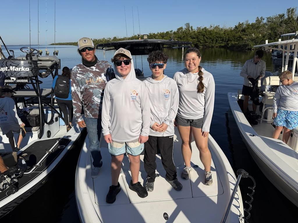 Valerie’s House children and teens with Captain James Marko on a fishing boat before their ESPN feature.