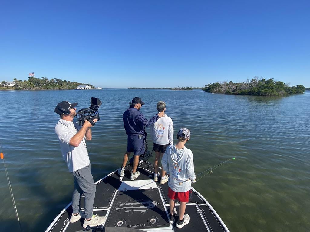 Valerie’s House children and teens with Captain James Marko on a fishing boat before their ESPN feature.