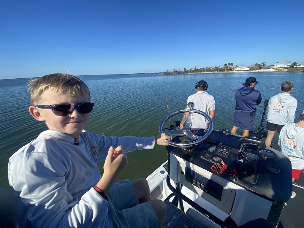 Valerie’s House children and teens with Captain James Marko on a fishing boat before their ESPN feature.