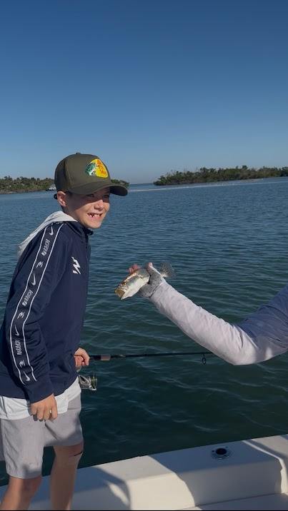 Valerie’s House children and teens with Captain James Marko on a fishing boat before their ESPN feature.
