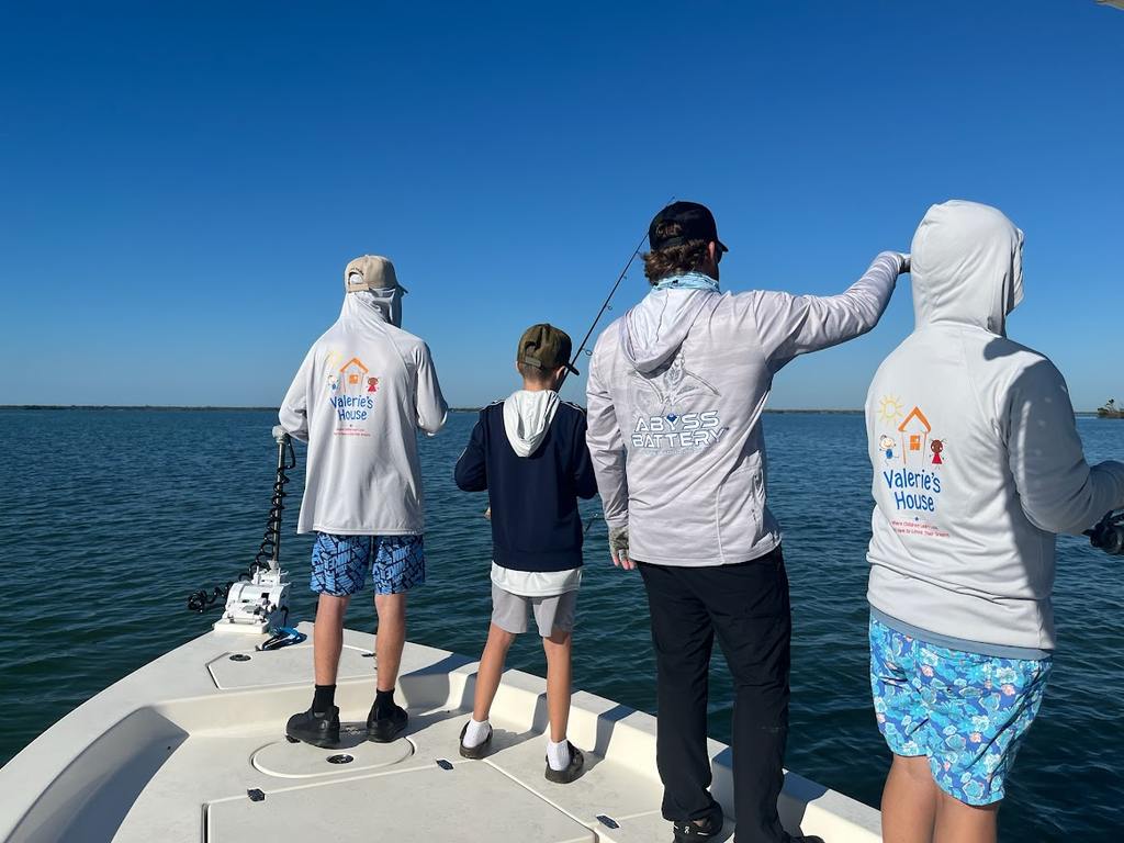 Valerie’s House children and teens with Captain James Marko on a fishing boat before their ESPN feature.
