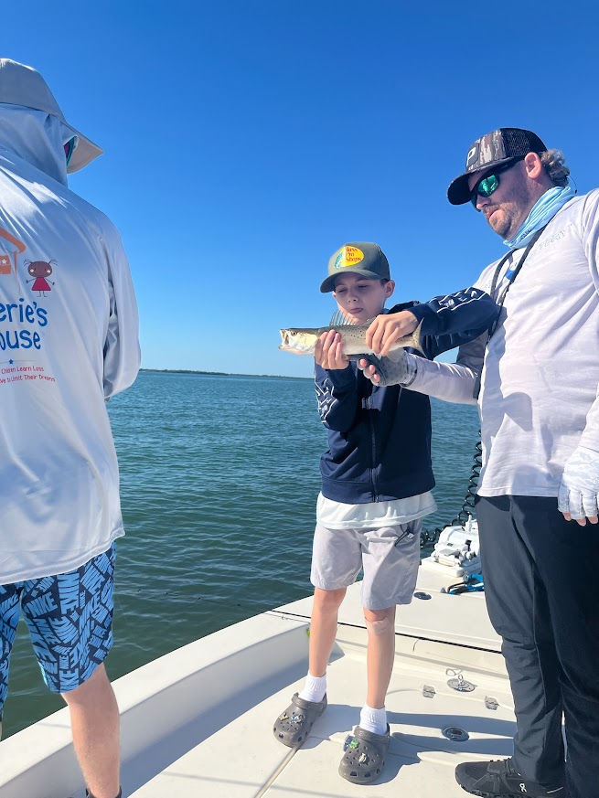 Valerie’s House children and teens with Captain James Marko on a fishing boat before their ESPN feature.