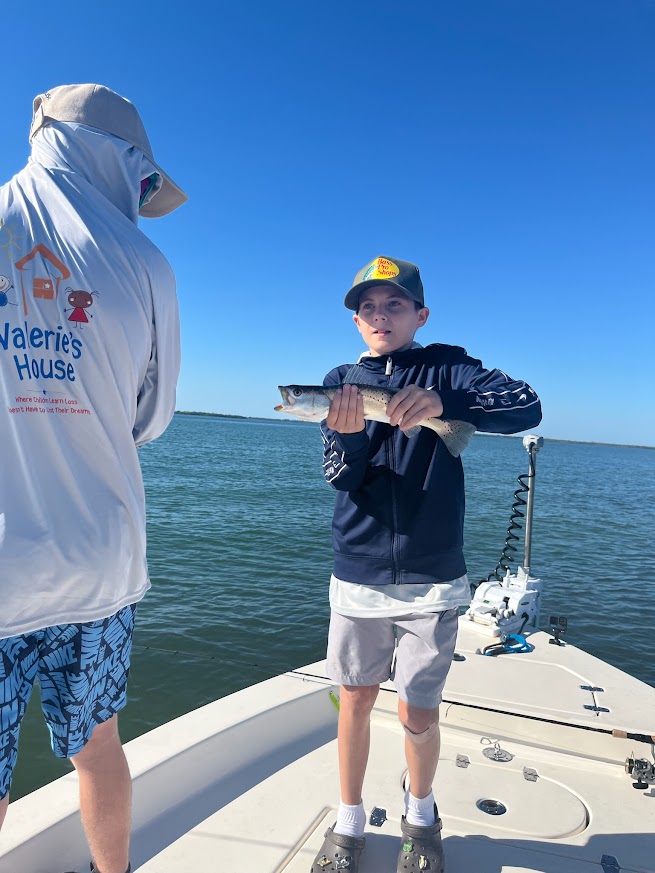 Valerie’s House children and teens with Captain James Marko on a fishing boat before their ESPN feature.