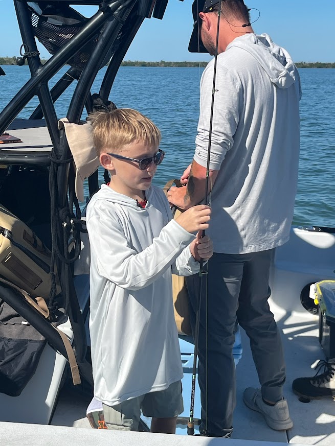 Valerie’s House children and teens with Captain James Marko on a fishing boat before their ESPN feature.
