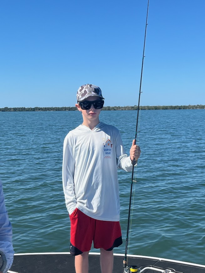 Valerie’s House children and teens with Captain James Marko on a fishing boat before their ESPN feature.