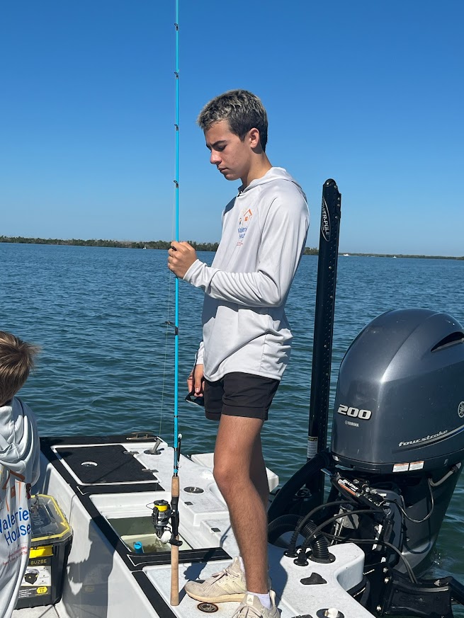 Valerie’s House children and teens with Captain James Marko on a fishing boat before their ESPN feature.