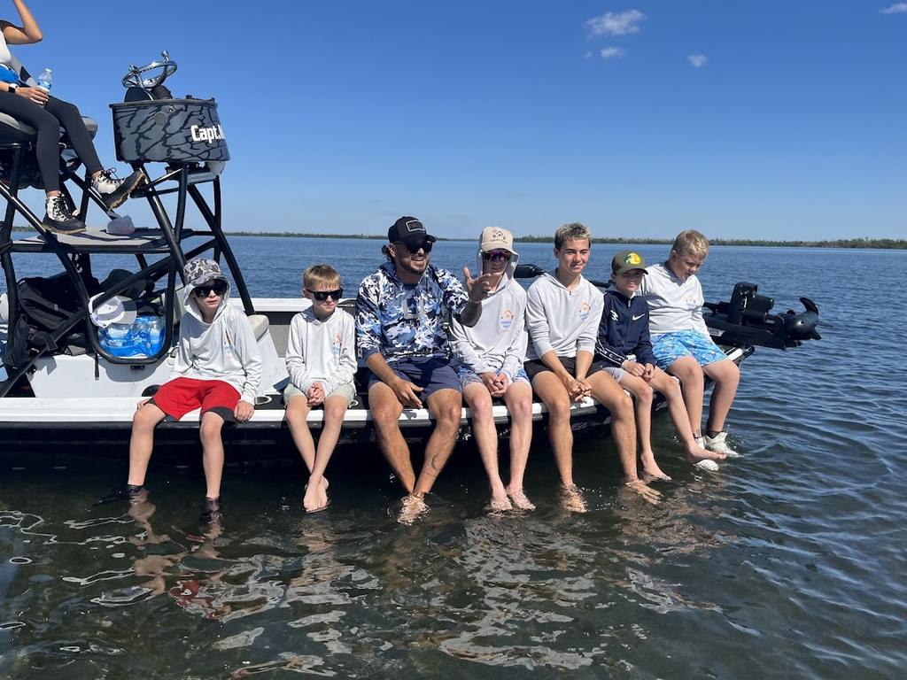Valerie’s House children and teens with Captain James Marko on a fishing boat before their ESPN feature.